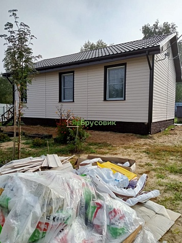 Отделка фасада дома, после периода усадки.